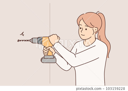 Woman uses electric drill to create hole in wall and hang shelf or picture in apartment Woman uses electric drill to create hole in wall and hang shelf or picture in apartment 103159228