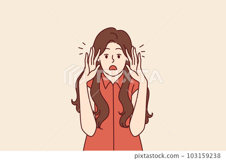 Shocked woman screams and looks at screen bringing palms to face after hearing frightening news 103159238