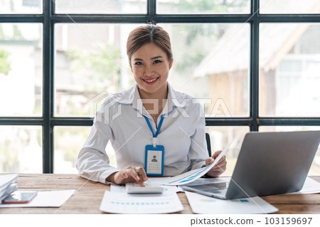 Accountant or business woman working Financial investment on calculator, calculate, analyze business and marketing growth on financial document data graph 103159697