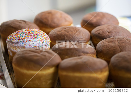 Industrial production of bread. Lots of baked goods on pallets. Freshly baked bun. Bakery Industrial production of bread. Lots of baked goods on pallets. Freshly baked bun. Bakery 103159822