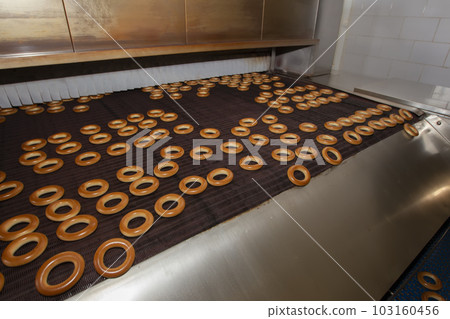 Industrial production of bagel bakery products. Barankin baking conveyor line.Bakery Industrial production of bagel bakery products. Barankin baking conveyor line.Bakery 103160456