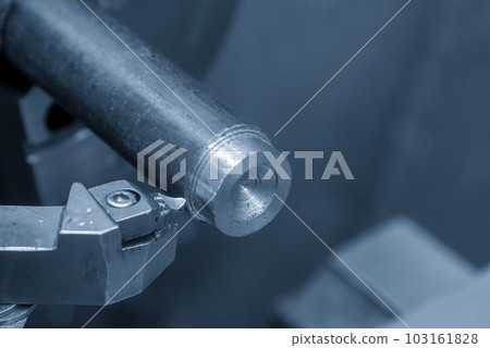 Close up scene the lathe machine finish cut the metal shaft parts by insert tools. Close up scene the lathe machine finish cut the metal shaft parts by insert tools. 103161828
