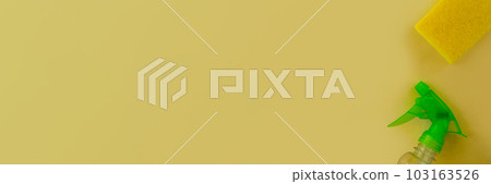 Banner. Cleaning. Flat lay Bottle with cleaning product, sponge against yellow background. Banner. Cleaning. Flat lay Bottle with cleaning product, sponge against yellow background. 103163526