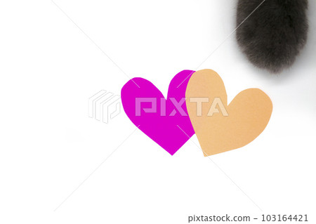 Background with two hearts and a cat's paw. 103164421
