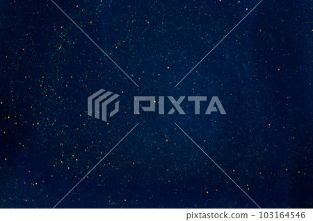 Shiny Dust Particles Galaxy in Blue Fluid. Gold glittering particles floating in a blue liquid. Abstract magic sparkling background. 103164546