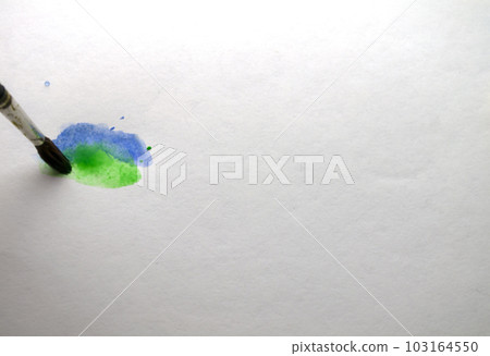 The brush draws blue and green paint. The brush draws blue and green paint. 103164550