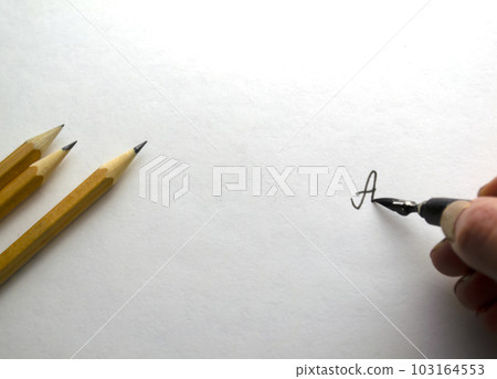 A woman writes with black ink on paper. A woman writes with black ink on paper. 103164553