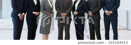 All members of a team of businessmen gather together Front Close-up of hands without faces All members of a team of businessmen gather together Front Close-up of hands without faces 103164913