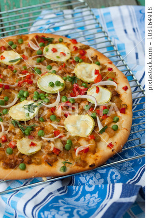 Vegetarian pizza with zucchini 103164918