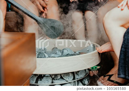 People who enjoy steaming in a sauna 103165580
