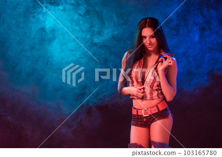 sexy young woman in erotic fetish wear dancing striptease in nightclub. Nude sexy woman in Show suit. sexy young woman in erotic fetish wear dancing striptease in nightclub. Nude sexy woman in Show suit. 103165780