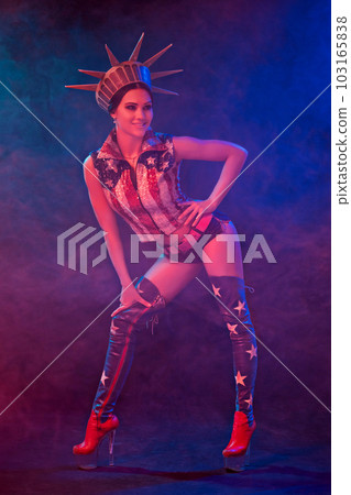 Young woman in stage costume of striptease dancer posing 103165838