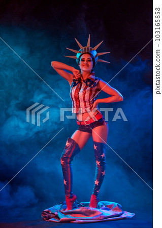 Young woman in stage costume of striptease dancer posing Young woman in stage costume of striptease dancer posing 103165858