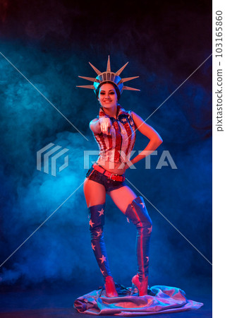 Young woman in stage costume of striptease dancer posing Young woman in stage costume of striptease dancer posing 103165860
