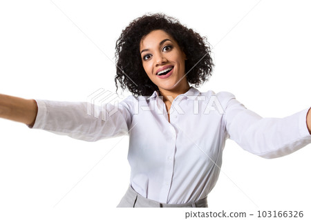 Young beautiful African American woman makes self against the white background in studio 103166326