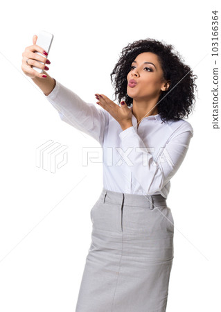 Beautiful brunette woman in classic white shirt and skirt make selfie on the phone. 103166364