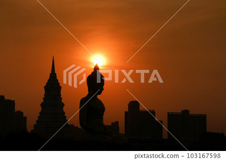 Huge Buddha statue and sunset at the temple "Wat Pak Nam" in Bangkok, Thailand Huge Buddha statue and sunset at the temple "Wat Pak Nam" in Bangkok, Thailand 103167598