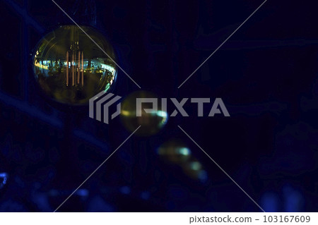 Warm electric incandescent lamp close up in a dark night Warm electric incandescent lamp close up in a dark night 103167609