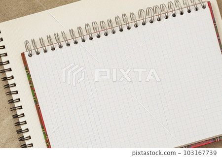 Open spiral bound notepad on background of scrapbook, copy space 103167739