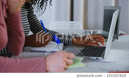Confident pretty Indian employee talking to business colleague at shared workplace. Female mentor teaching intern, telling about work project. Manager and client discussing online product at laptop Confident pretty Indian employee talking to business colleague at shared workplace. Female mentor teaching intern, telling about work project. Manager and client discussing online product at laptop 103167828