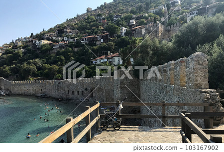 Turkey, Alanya, View of the sea, mountains and the old town, there is a pram on the road. Turkey, Alanya, View of the sea, mountains and the old town, there is a pram on the road. 103167902