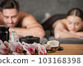 Couple lying in spa salon 103168398