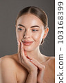 Beautiful Spa Woman Touching her Face 103168399