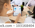 Diverse business people work in office 103168404