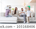 Family playing dinosaurs at home 103168406