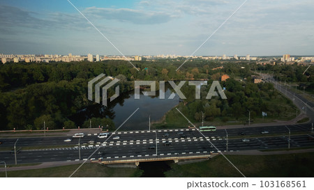 City highway. Overpass across the river. On the horizon at home. Aerial photography. City highway. Overpass across the river. On the horizon at home. Aerial photography. 103168561