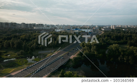 City highway. Overpass across the river. On the horizon at home. Aerial photography. 103168569