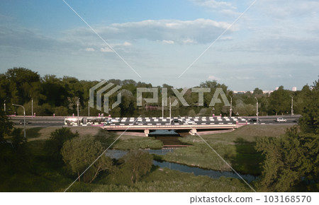 City highway. Overpass across the river. On the horizon at home. Aerial photography. 103168570