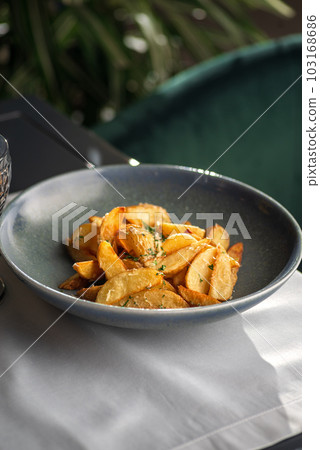 Potato country style with dill in bowl. Healthy diet food. copy space. Potato country style with dill in bowl. Healthy diet food. copy space. 103168686