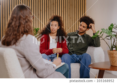 couple of man and woman at psychologist, taking care of mental health in relationship.  couple of man and woman at psychologist, taking care of mental health in relationship.  103168952