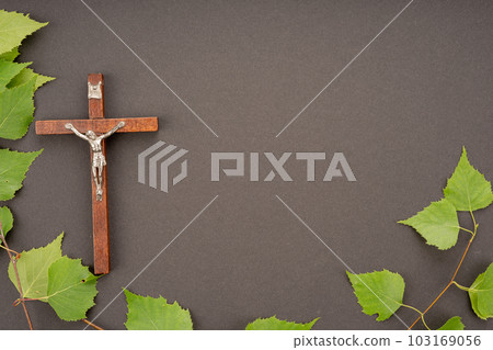 Christian Pentecost. Whit Sunday. A cross with a birch branch on a white, green, red and black background. 103169056