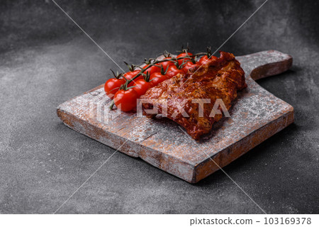 Delicious grilled or smoked pork ribs with salt, spices and herbs Delicious grilled or smoked pork ribs with salt, spices and herbs 103169378