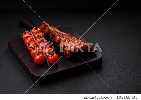 Delicious grilled or smoked pork ribs with salt, spices and herbs Delicious grilled or smoked pork ribs with salt, spices and herbs 103169433