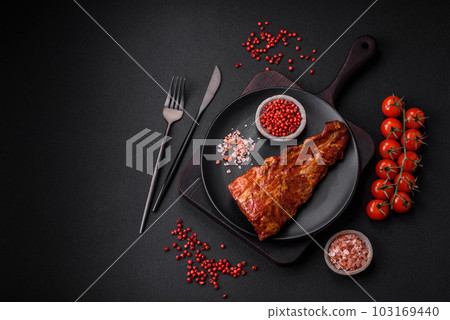 Delicious grilled or smoked pork ribs with salt, spices and herbs Delicious grilled or smoked pork ribs with salt, spices and herbs 103169440