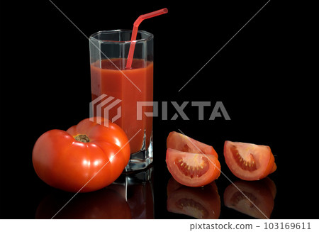 Juicy fresh red tomatoes. Tomato segments on a black background 103169611
