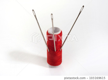 Red thread on white background 103169615