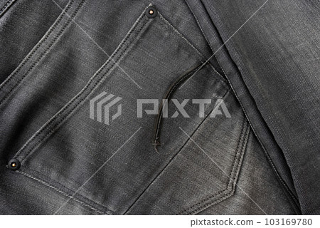 The texture of denim or the background of gray jeans. Clothing industry 103169780