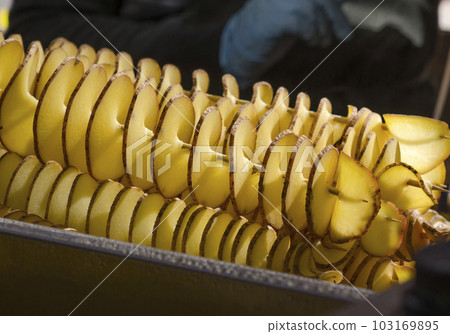 Juicy potato in the form of a spiral 103169895
