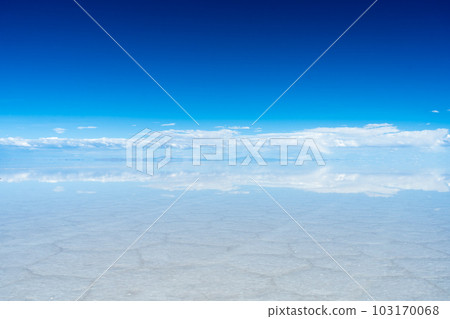 Uyuni Salt Flats. Altiplano, Bolivia. Rainy Season. Tunupa Volcano. Clouds Reflection on Water in Uyuni Salt Flats. Altiplano, Bolivia. Rainy Season. Tunupa Volcano. Clouds Reflection on Water in 103170068