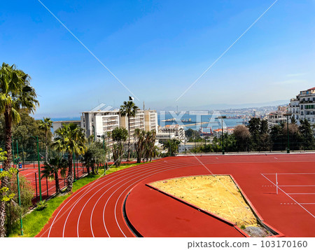 Red clay stadium near the sea in Algiers, Algeria. High quality photo Red clay stadium near the sea in Algiers, Algeria. High quality photo 103170160