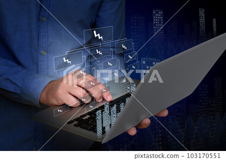 A young man is using a laptop with a virtual screen. Electricity problems. Global network and data exchange in human hands A young man is using a laptop with a virtual screen. Electricity problems. Global network and data exchange in human hands 103170551