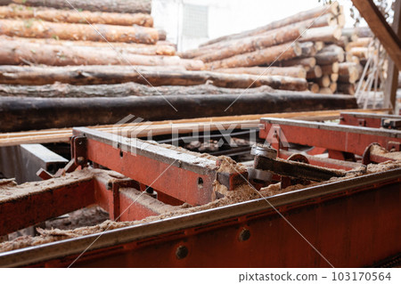 Old sawmill equipment in a warehouse. Timber industry 103170564