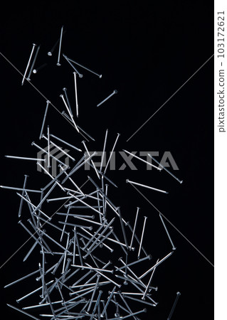 Long Nail fly floating in mid air. Many group screw nails short long metal fall as construction tools. Black background isolated. New Screwdriver Nail fall down unbox steel hardware work Long Nail fly floating in mid air. Many group screw nails short long metal fall as construction tools. Black background isolated. New Screwdriver Nail fall down unbox steel hardware work 103172621