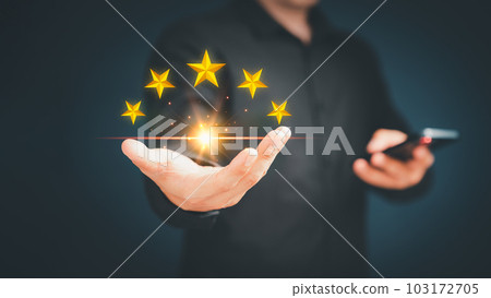 Customer or client man hand showing the stars icon to complete five stars. Assessment customer service giving the five star rating, service feedback, satisfaction and testimonial concept. Customer or client man hand showing the stars icon to complete five stars. Assessment customer service giving the five star rating, service feedback, satisfaction and testimonial concept. 103172705
