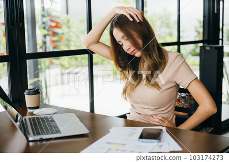 Businesswoman freelance suffering from neck ache pain caused by long time laptop usage, Tired office female sitting at desk touching massaging stiff neck while holding her head in cafe coffee shop 103174273