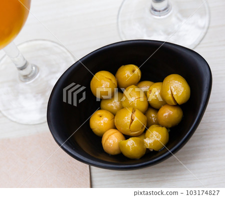 Pickled olives with a stone - a typical Spanish tapas. 103174827